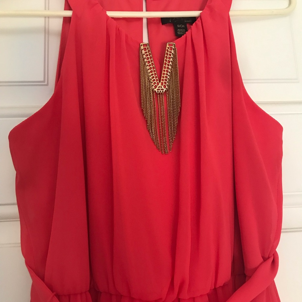 Coral color dress with gold neckline detail